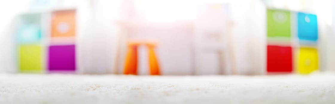Blurred background of the colourful child room. Concept of the background, backdrop and wallpaper.