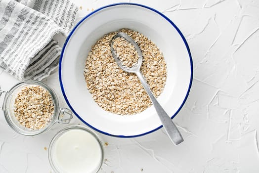 Oatmeal plate. Oatmeal served with fresh milk. Healthy food, diet. Top view.