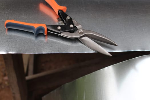thin sheet of metal cut with metal