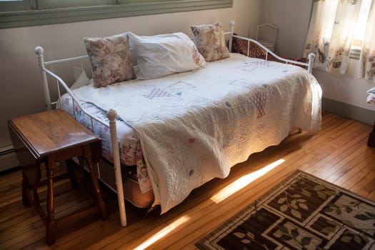 A bedroom with light streaking in.