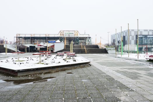 Sremska Mitrovica, Serbia January 27 2023 Pinky Swimming Pool and Pinky Sports Centre. Modern sports buildings, gray and white facade. Snow in winter. Venue for sporting events for adults and children