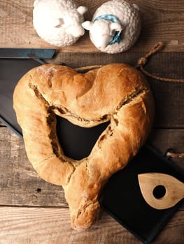 Yeast dough formed into a heart, baked until golden brown, traditional handwork, Easter bread