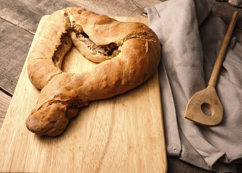 Yeast dough formed into a heart, baked until golden brown, traditional handwork, Easter bread