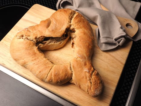 Yeast dough formed into a heart, baked until golden brown, traditional handwork, Easter bread