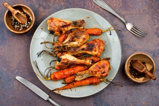 Grilled chicken drumsticks, roast chicken legs with carrots