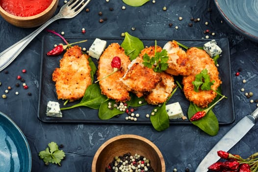 Grilled spicy chicken breasts in breadcrumbs, chicken meat. Homemade chicken nuggets