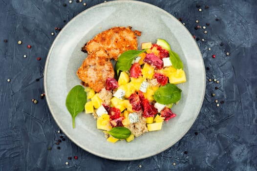 Tasty salad with fruit, chicken fillet and quinoa. Detox diet