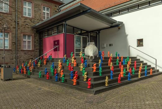 Colorful garden gnomes stand on a staircase in front of the Citymuseum Hofheim am Taunus