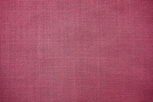 Cloth close-up. Interlacing of threads. A piece of pink fabric. Fabric background. Copy space.