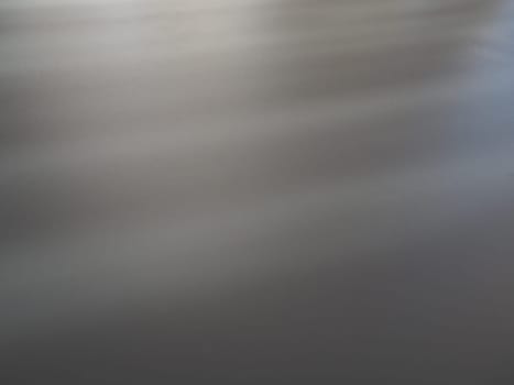 Illumination rays on gray surface. Abstract rays of light and lens flare on a gray background. Vertical, horizontal and diagonal light stripes.
