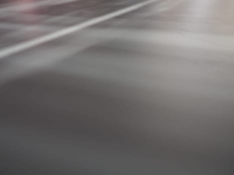 Illumination rays on gray surface. Abstract rays of light and lens flare on a gray background. Vertical, horizontal and diagonal light stripes.