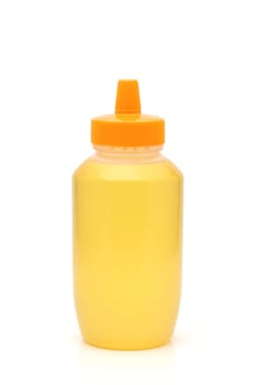 Plastic bottle of honey on white background