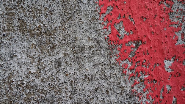 Dirty concrete with a stroke of pink paint
