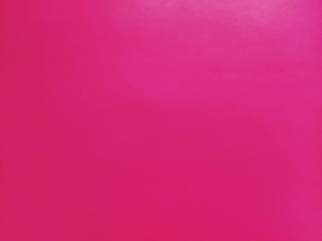 Deep pink Festive Valentine's abstract background. Crimson or bright purple background for New Year, Christmas and Valentine's Day. Bright sheet of colored paper.