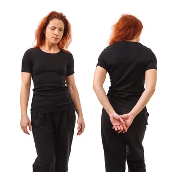 Photo of a young beautiful redhead woman with blank black shirt, front and back. Isolated over white background and ready for your design or artwork.