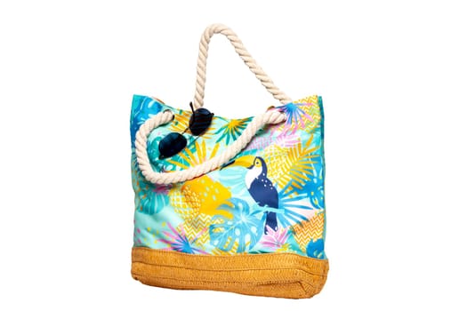 Colorful beach bag isolated on a white background. Clipping path. Summer holidays, vacation and travel concept. Beach handbag for travel.