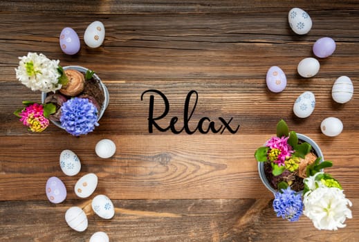 Easter Flat Lay With English Text Relax. Flowers With Easter Egg Decoration And Ornament. Hyacinth Flower Arrangement With Wooden, Vintage Background.