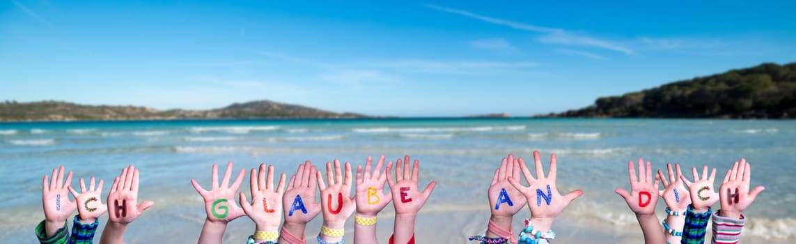Children Hands Building Colorful German Word Ich Glaube An Dich Means I Believe In You. Summer Ocean, Sea And Beach As Background.