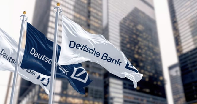Berlin, DE, March 2023: Flags of Deutsche Bank waving in the wind in a financial district. On march 2023 Deutsche Bank suffered a stock market crash. Illustrative editorial 3d illustration render