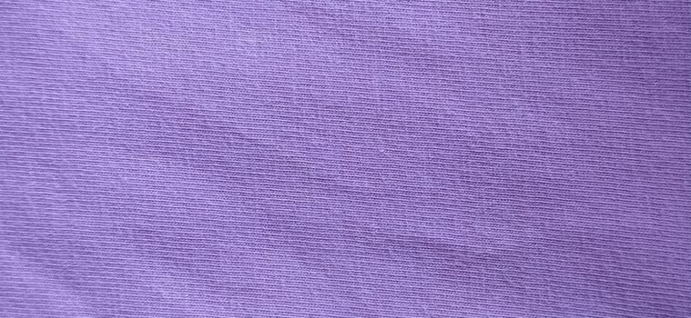 Crumpled pink cotton fabric. Close-up. Fabric texture.