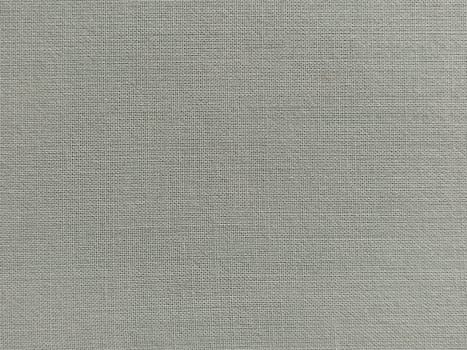 pale light green fabric. A piece of woolen fabric laid out neatly on the surface. Interlacing and textile texture. dress fabric or for kitchen needs, tablecloth or curtains.