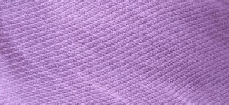 Crumpled pink cotton fabric. Close-up. Fabric texture.