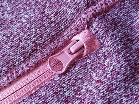 pink lock with a slider on the knitted fabric