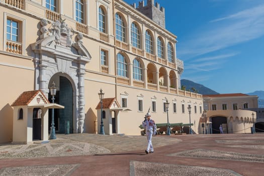 Monte Carlo - August 2022: guard with Summer uniform walking in front of the Royal Palace