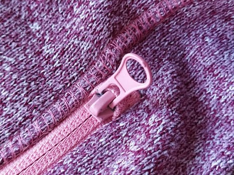 pink lock with a slider on the knitted fabric