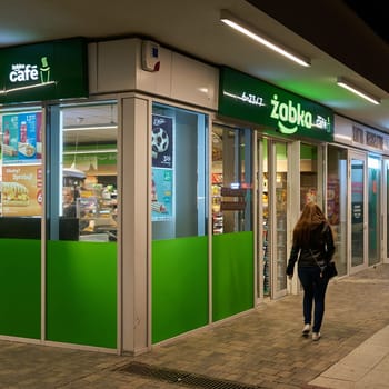 Store of the Polish retailer Zabka on the promenade of Swinoujscie in the evening