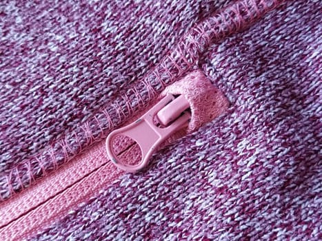 pink lock with a slider on the knitted fabric