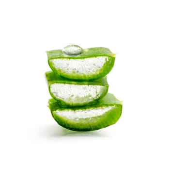 Closeup of aloe vera slices with water drop isolated over white background. Organic herbal ingredient for alternative medicine and skin and hair treatment beauty product.