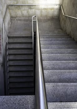 Detail of access stairs for pedestrians in a street in the city, access to the subway