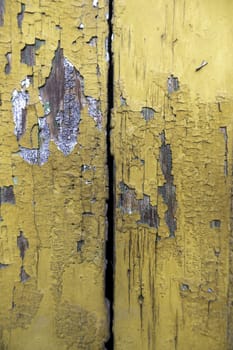 Detail of old wooden wall painted and damaged by the passage of time, ruin and abandonment