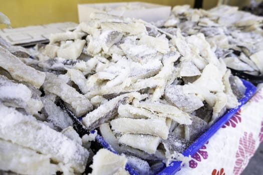 Detail of dried fish with salt, conservation and healthy food, diet