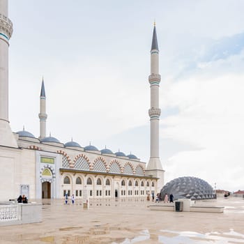 Istanbul, Turkey - August 31 2022: Grand Camlia Mosque, or Buyuk Camlica Camii, with few pedestrians, a modern complex for Islamic worship, built in 2019, located in Camlica hill, Uskudar