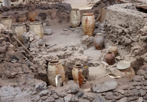 Santorini, Greece - July 01, 2021: Recovered ancient pottery in prehistoric town of Akrotiri, excavation site of a Minoan Bronze Age settlement on the Greek island of Santorini