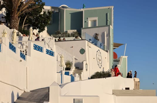 Imerovigli, Santorini, Greece - June 29, 2021:  Whitewashed houses in Imerovigli on Santorini island, Cyclades, Greece