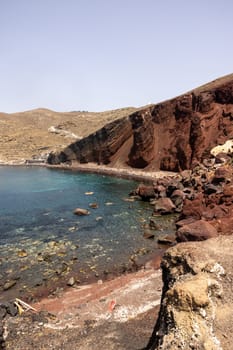 Santorini, Greece - July 01, 2021: The famous Red beach on the south coast of Santorini island, Cyclades, Aegean Sea.