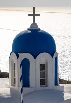 Blue dome of  greek orthodox Christian church in Oia. Santorini, Greece