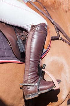 Horse Rider leg boot saddle leather details closeup