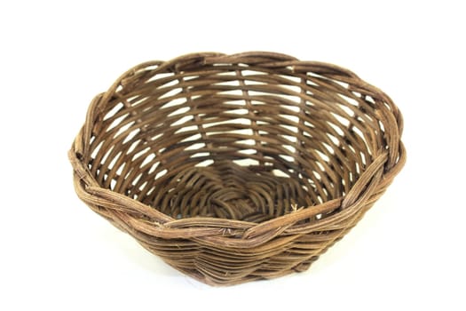 braided willow basket against a bright background