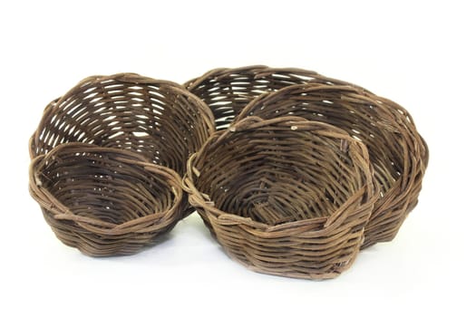 braided willow baskets against a bright background