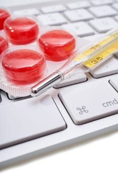 Macro recording thermometers and halpastilles on keyboard