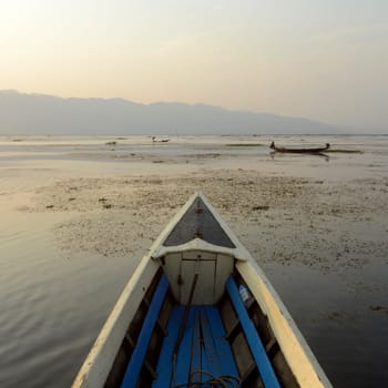 the Landscape at sunrise on the Inle Lake in the Shan State in the east of Myanmar in Southeastasia.