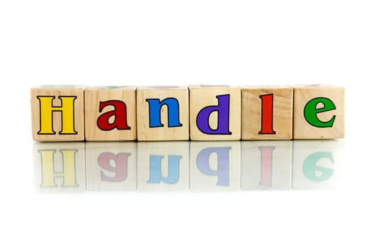 handle colorful wooden word block on the white background