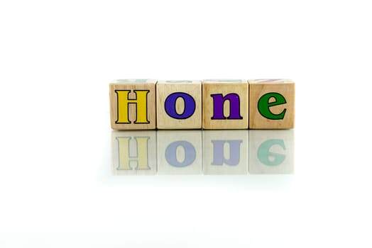 hone colorful wooden word block on the white background