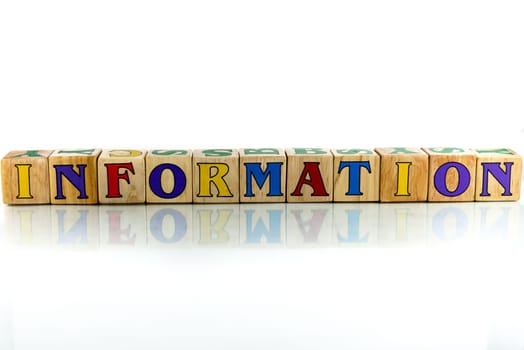 information colorful wooden word block on the white background
