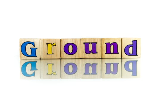 ground colorful wooden word block on the white background
