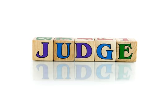 judge colorful wooden word block on the white background